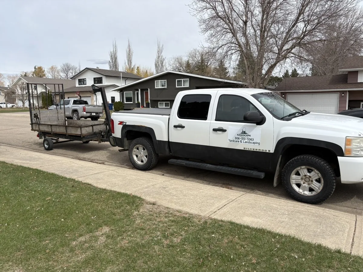 SaskScape branded work truck and trailer for yard care in Moose Jaw Saskatchewan