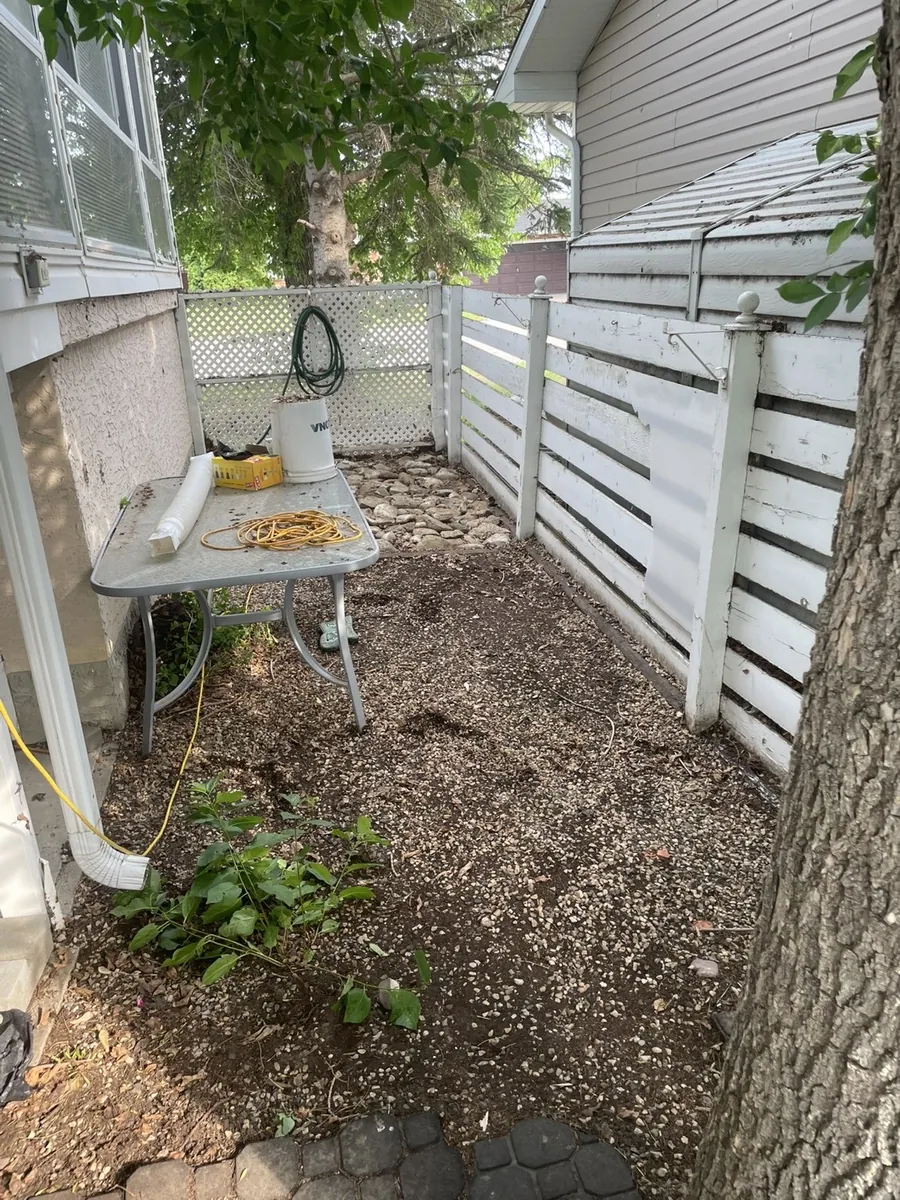 Cleaned side yard after leaf cleanup in Moose Jaw Saskatchewan
