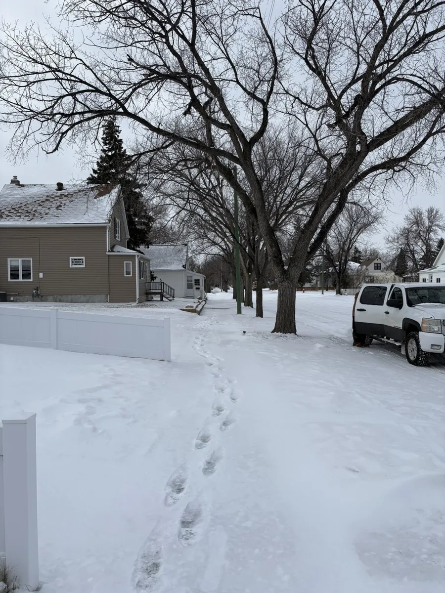 Snow-covered front walkway before snow removal in Moose Jaw Saskatchewan