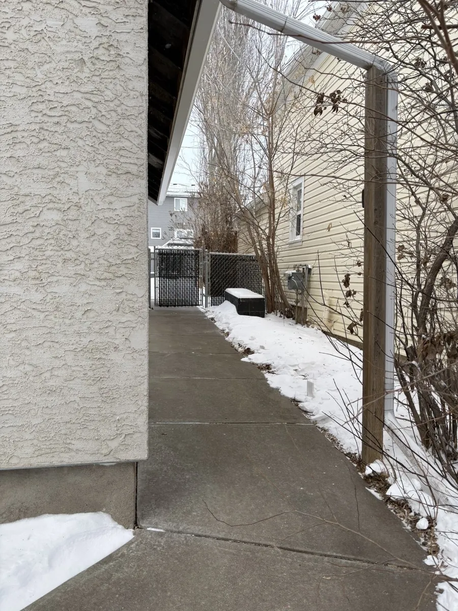 Shoveled clean side pathway after snow removal in Moose Jaw Saskatchewan