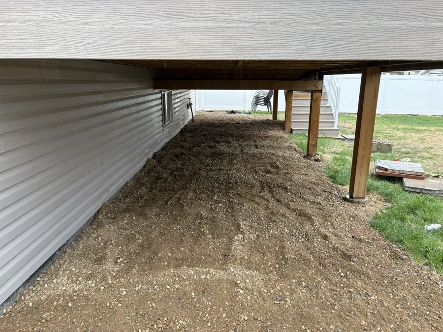 Fresh gravel spread under a deck in Moose Jaw Saskatchewan